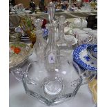 3 glass decanters and a fruit bowl