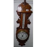 An acanthus leaf carved aneroid barometer, L90cm