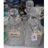 3 cut-crystal decanters with labels, and a plated cocktail shaker, 8"