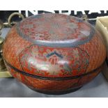 A Chinese lacquered box and cover with floral designs, 8" diameter