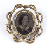 A Victorian ivory and photo oval swivel mourning brooch, in gold plated frame, height 53.3mm