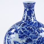 A Chinese blue and white porcelain bottle vase, with painted dragon and wave decoration, height 33cm