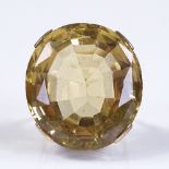 A large unmarked gold oval-cut citrine dress ring, citrine length 28.4mm, size G, 18.9g