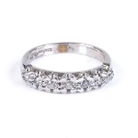 A 9ct white gold 7-stone half eternity ring, setting height 4mm, size O, 3.3g