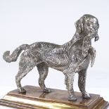 A Victorian silvered bronze Gundog holding a pheasant, base length 21cm