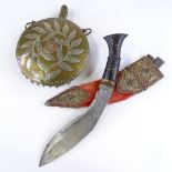 An Eastern ornate kukri knife with coral and turquoise set filigree mounts, and an Eastern brass