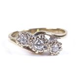 A 9ct gold 3-stone diamond crossover ring, total diamond content approx 0.2ct, setting height 9.3mm,