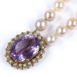 A double strand Princess pearl necklace, with unmarked gold amethyst and pearl clasp, necklace