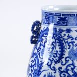 A large Chinese blue and white porcelain vase, hand painted dragon and scroll decoration, with