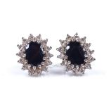 A pair of 18ct white gold sapphire and diamond cluster earrings, setting height 11.8mm, 3.6g