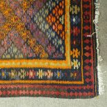 An orange ground Kilim runner with red diamond border, 10' x 3'10"