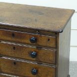 A 19th century mahogany batchelor's chest of drawers, with wooden brushing slide and turned ebony