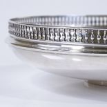 A George V circular silver fruit bowl, with pierced pillar gallery, by Walker & Hall, hallmarks