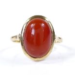An 18ct gold cabochon carnelian ring, setting height 16.2mm, size O, 4.1g