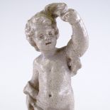 A Leeds Fireclay Company Burmantofts Pottery cherub and dolphin design garden statue, LEFCO