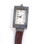 An Art Deco Swiss silver P Didisheim fob lapel watch, 15 jewel mechanical movement with green