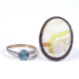 A 9ct gold single stone blue zircon ring, size O, together with a silver and agate panel ring,