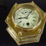 A Victorian brass-cased desk clock of hexagonal form, enamel dial and secondary dial, bevel-glass