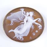 An oval relief carved cameo shell brooch, depicting angel and cherub, in 9ct gold rope twist