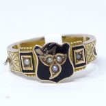 A 9ct gold pearl, black enamel and hair mourning ring, with inset woven hair shank and central