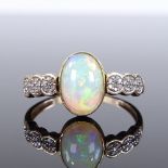 A 9ct gold opal and diamond dress ring, setting height 11.6mm, size Q, 2.5g