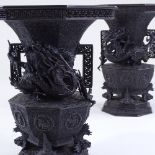 A pair of Japanese Meiji period bronze vases, 3-dimensional dragon mounted necks, with pierced