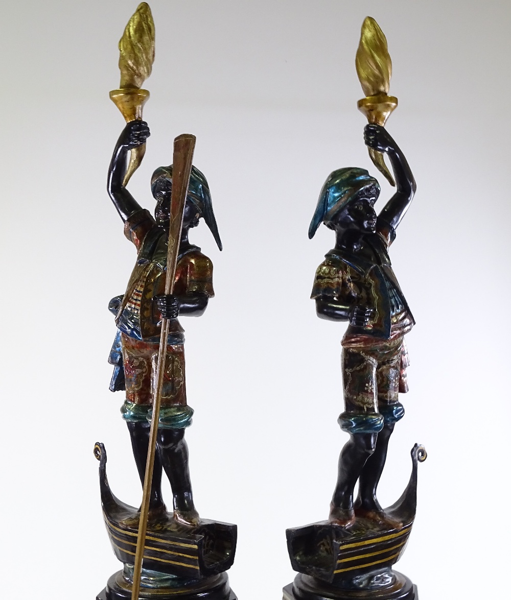 A pair of Italian carved and painted wood gondolier torchere figures, on gilded octagonal pedestals, - Image 2 of 3