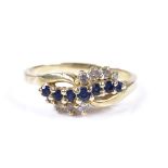 A 14ct gold sapphire and diamond crossover dress ring, setting height 8.2mm, size R, 3.4g