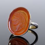 A silver-gilt relief carved carnelian seal ring, depicting male with wreath, setting height 20.