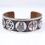 A Quincy Jones Foundation silver and copper Symbols of Religion bangle, made for Harrods, internal