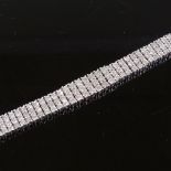 A sterling silver diamond triple row bracelet, length 19cm, 29.2g