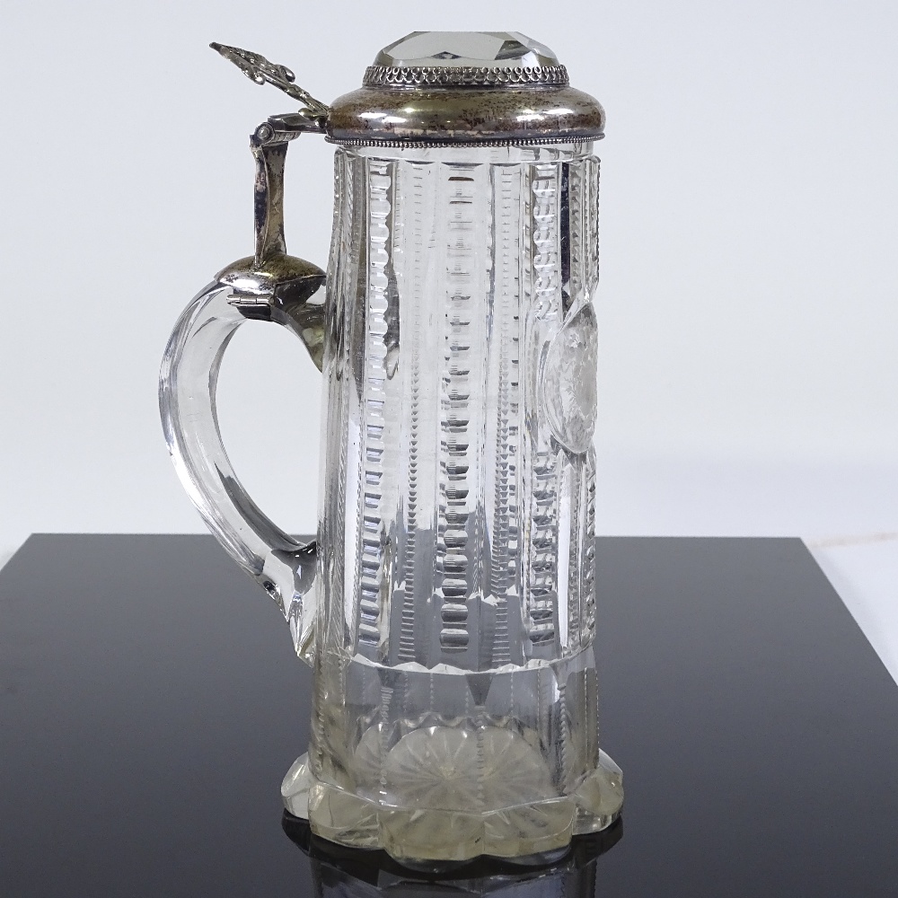 A 19th century cut-glass lidded tankard of small size, with unmarked silver mounts and inset facet- - Image 2 of 3