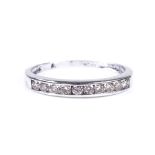 A 9ct white gold diamond half eternity ring, total diamond content approx 0.25ct, setting height 2.