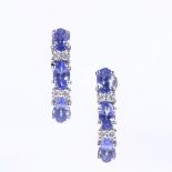A pair of 10ct white gold tanzanite and diamond hoop earrings, total tanzanite content approx 1.4ct,
