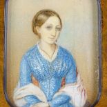 A 19th century miniature watercolour portrait of a lady, unsigned, in original walnut and ebonised
