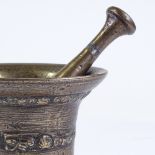 A 17th century bronze pestle and mortar, with relief moulded band, probably from The Whitechapel