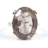 A 9ct gold large oval smoky quartz dress ring, quartz length 20mm, size T, 6.9g