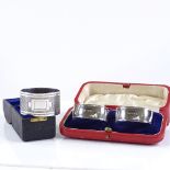 A cased pair of silver napkin rings, by James Dixon & Sons, hallmarks Sheffield 1907, together