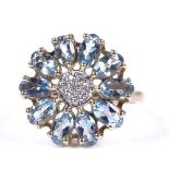 An unmarked gold blue stone and diamond daisy ring, setting diameter 16.7mm, size M, 3.6g