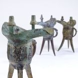 3 Chinese verdigris bronze Archaic style lamp stands, height 19cm