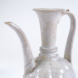 A Chinese white glaze porcelain ewer, collection label under base, height 28cm