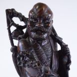 A Chinese early 20th century carved hardwood figure of a farmer, height 51cm