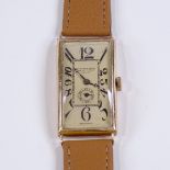 An Art Deco 9ct gold rectangular wristwatch, by Schuler & Sons of London, Deco Arabic numerals, with