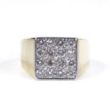 A large 18ct gold diamond panel signet ring, total diamond content approx 1ct, panel height 11.