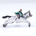 An unmarked silver and enamel jockey pendant/brooch, 35.6mm across, 6.1g