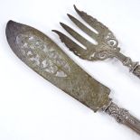 A pair of Victorian silver fish servers, with relief embossed foliate handles and engraved blades,