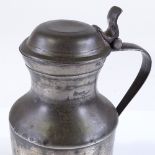 An Antique pewter lidded flagon with London touch marks, height 20cm