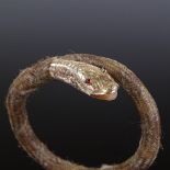 A Victorian unmarked gold garnet and woven hair memorial snake bangle, with engraved head and tail