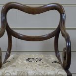 A 19th century mahogany-framed scroll armchair
