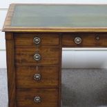 A Victorian mahogany pedestal desk, with green leather top, and 9 drawers below, with locking stiles